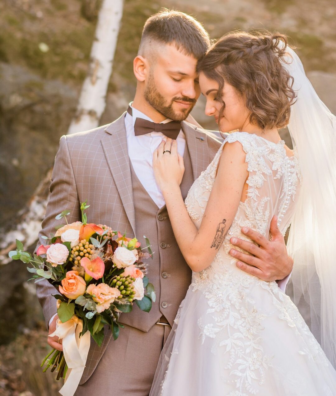 woman in white wedding dress holding bouquet of flowers