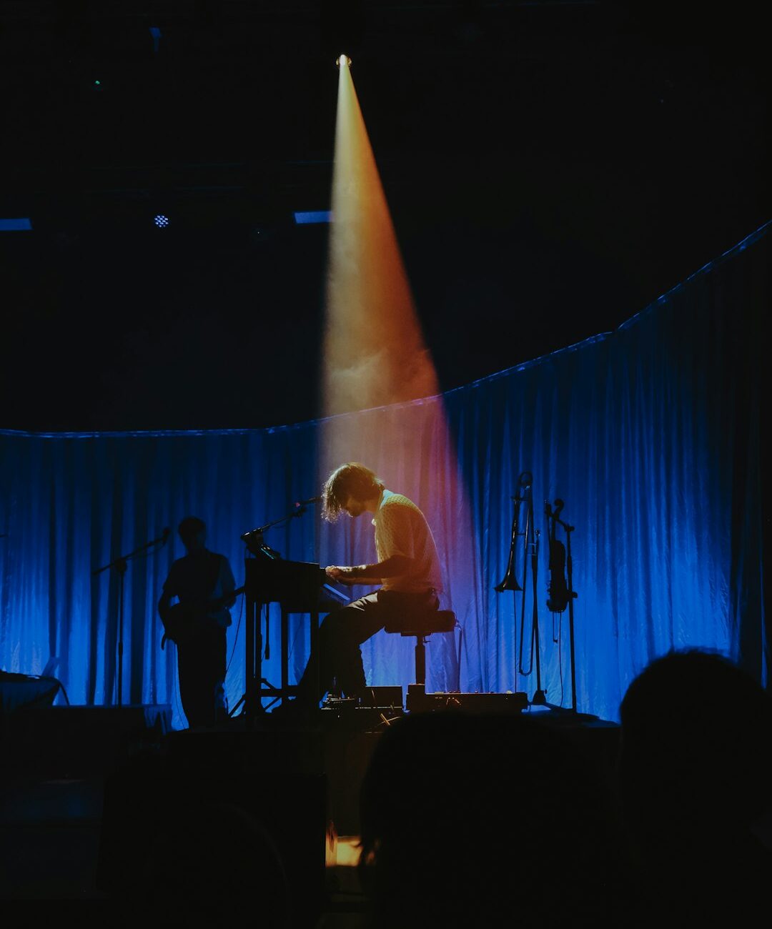 A person on a stage with a microphone