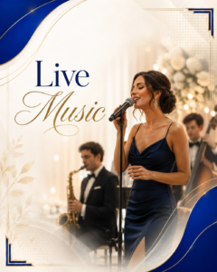 Female singer in a navy blue gown performs into a microphone while a backing band plays in the background at a formal event.