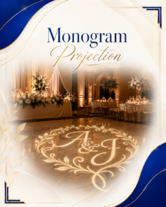Elegant wedding venue backdrop showing 'Monogram Projection' in blue and gold, with the initials A & J projected on a marbled dance floor surrounded by candles and flowers.